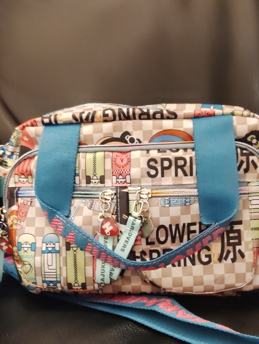 Playful Cartoon Print Crossbody Bag with Turquoise Accents